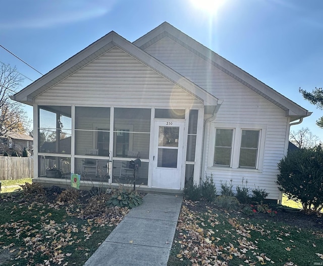 view of front facade with a sunroom