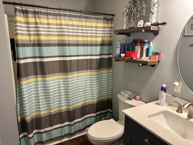 bathroom with vanity, toilet, hardwood / wood-style flooring, and a shower with shower curtain