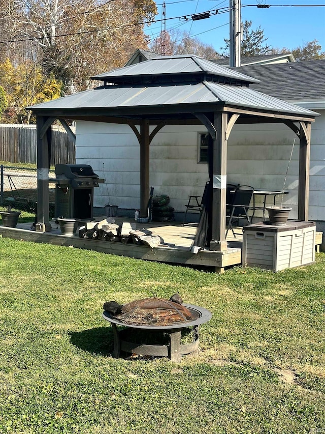 view of yard with a gazebo and an outdoor fire pit