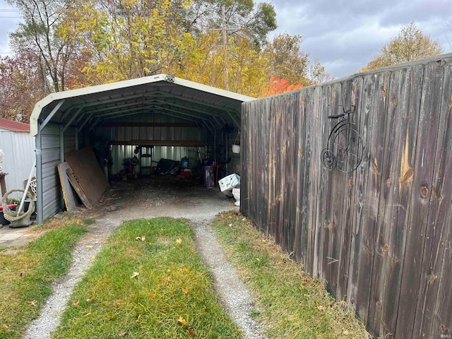 view of vehicle parking featuring a carport