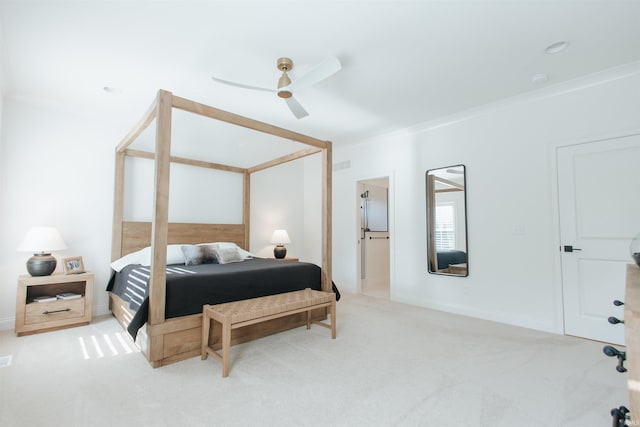 bedroom with ceiling fan, ornamental molding, and light colored carpet