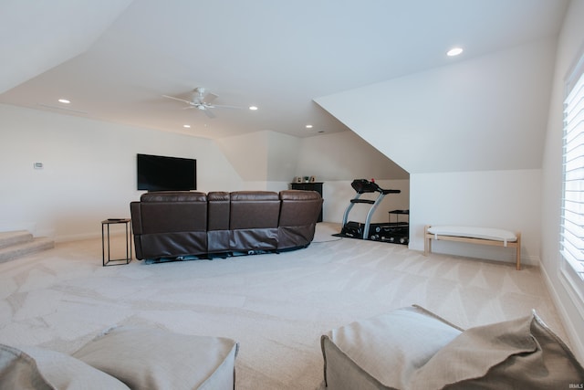 living room featuring light carpet, a wealth of natural light, and ceiling fan