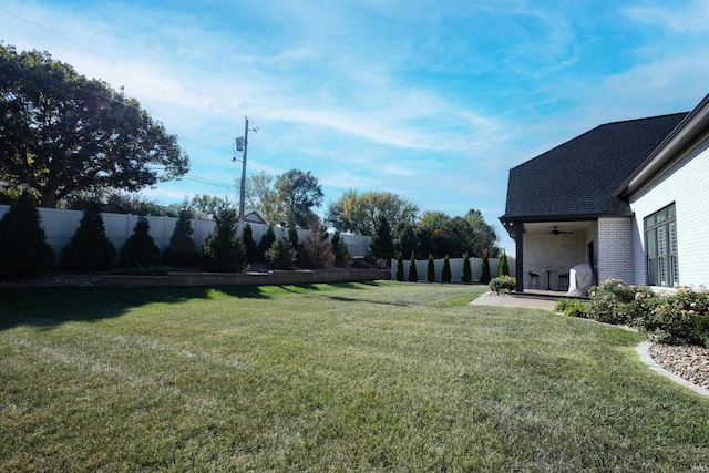 view of yard featuring ceiling fan