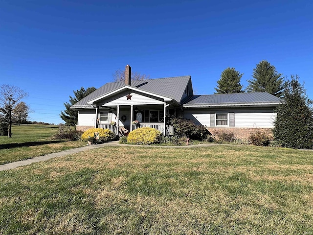 view of front facade with a front lawn and a porch