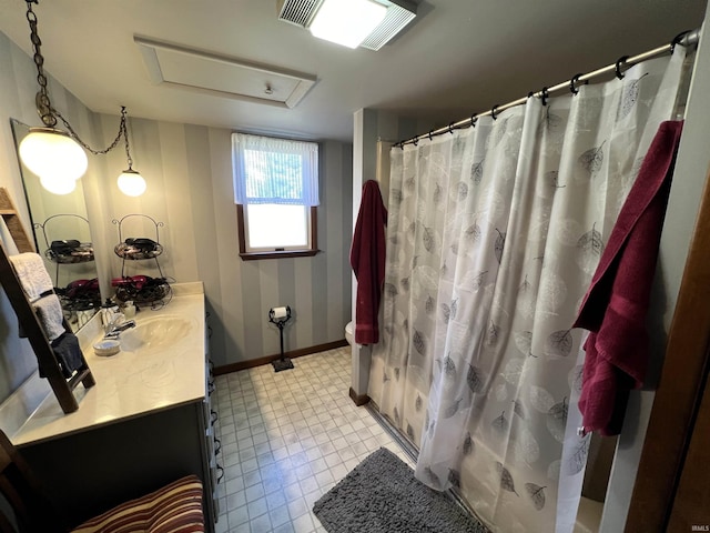 bathroom with walk in shower and vanity