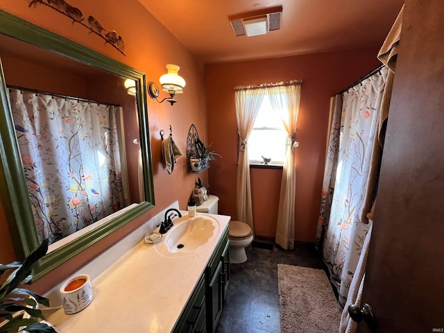 bathroom with vanity and toilet