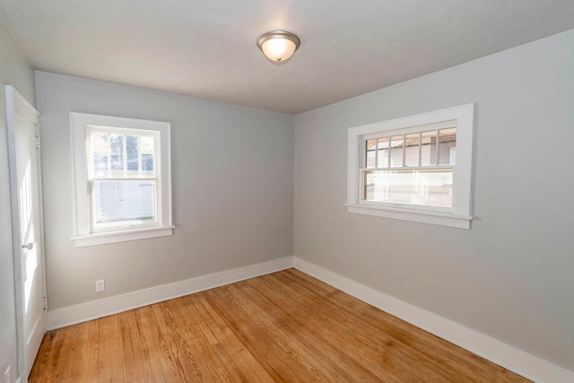 unfurnished room with light hardwood / wood-style floors