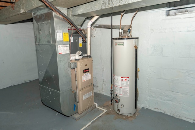 utility room featuring heating unit and gas water heater