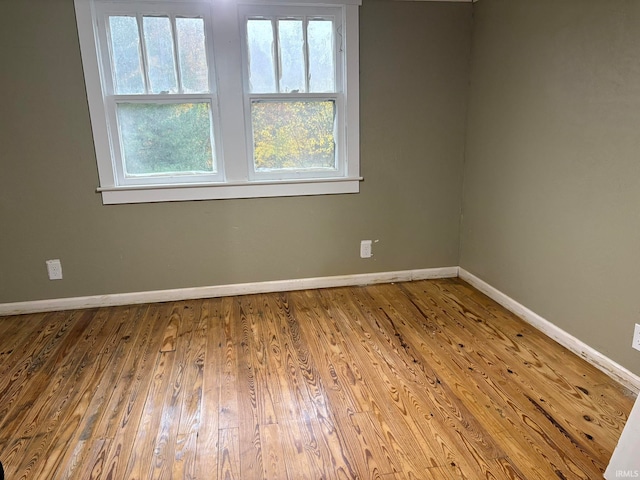 unfurnished room featuring wood-type flooring