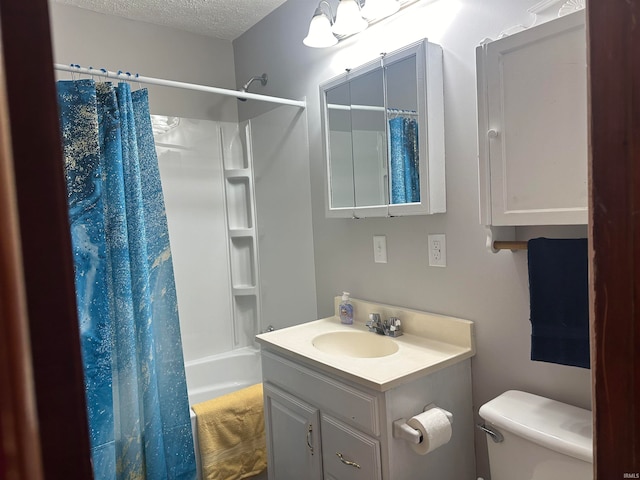 full bathroom with a textured ceiling, toilet, shower / bath combo, and vanity