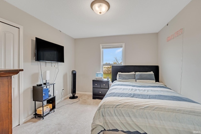 bedroom featuring light colored carpet