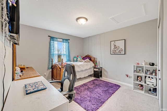 carpeted bedroom featuring a textured ceiling