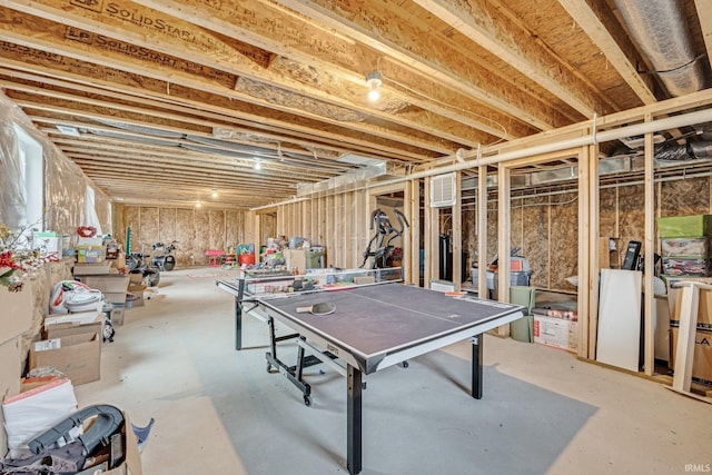 recreation room with concrete floors