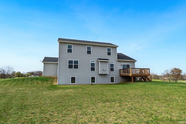 back of house featuring a wooden deck and a lawn