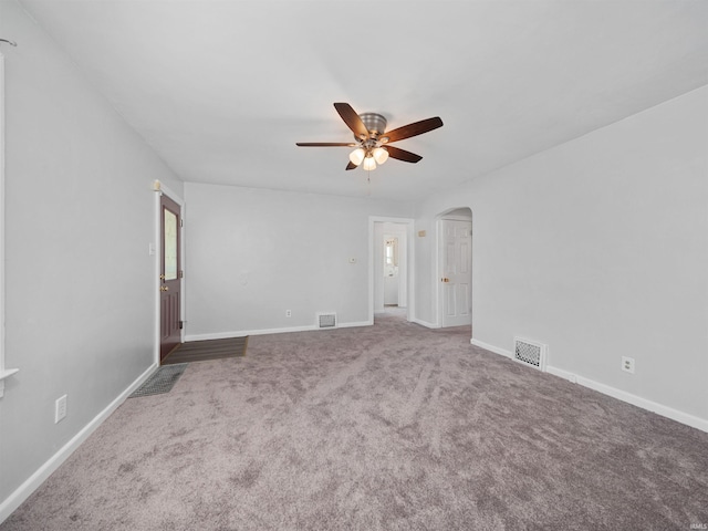 carpeted spare room with ceiling fan