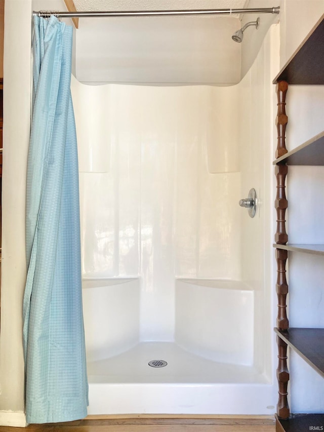 bathroom featuring a shower with curtain