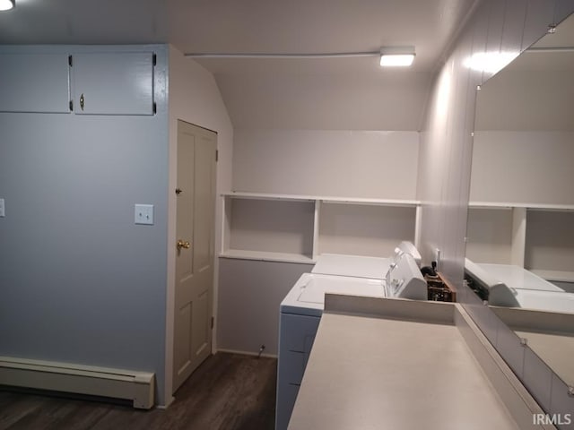 clothes washing area with baseboard heating, separate washer and dryer, and dark wood-type flooring