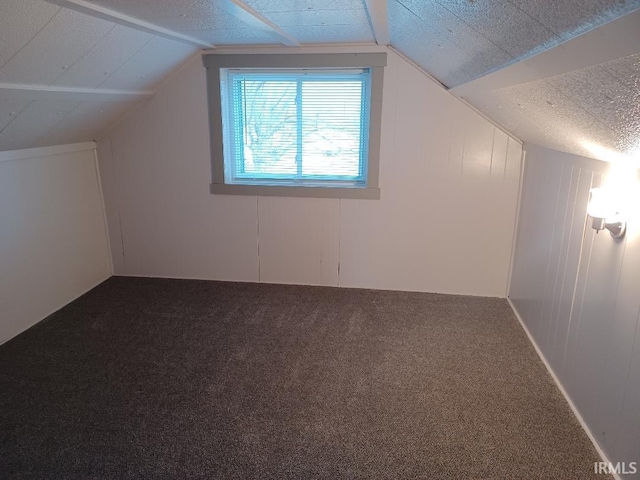 bonus room featuring carpet and lofted ceiling