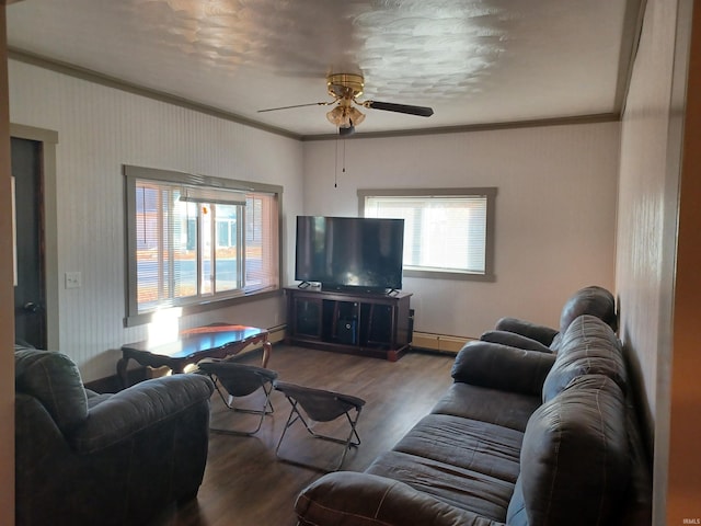 living room featuring hardwood / wood-style floors, baseboard heating, ceiling fan, and ornamental molding