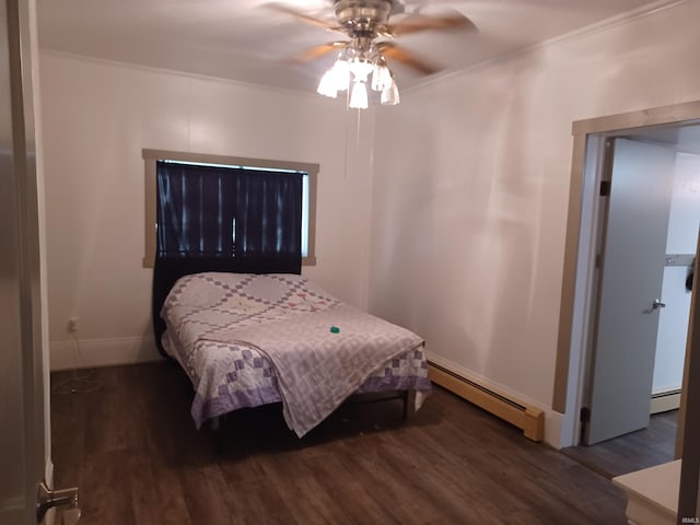 bedroom with ceiling fan, dark wood-type flooring, a baseboard radiator, and ornamental molding