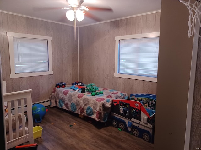 bedroom featuring ceiling fan, crown molding, and dark wood-type flooring