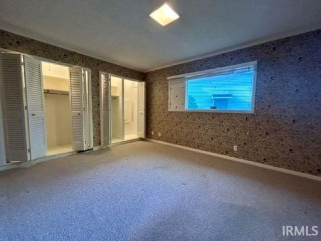 unfurnished bedroom with carpet