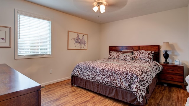 bedroom featuring light hardwood / wood-style floors and ceiling fan