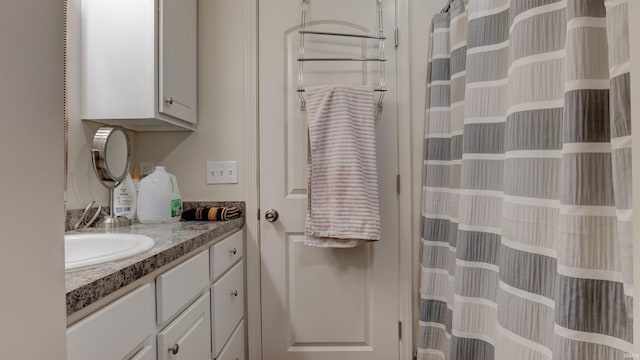 bathroom featuring vanity and a shower with curtain