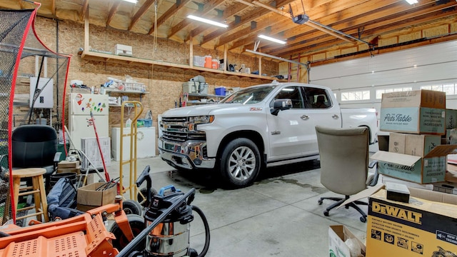 garage with white refrigerator