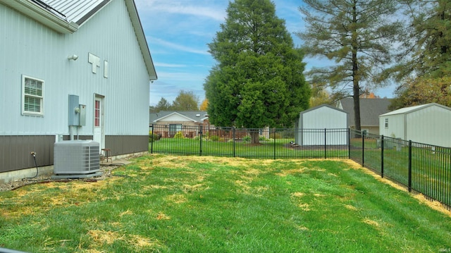 view of yard with a storage shed and central AC unit