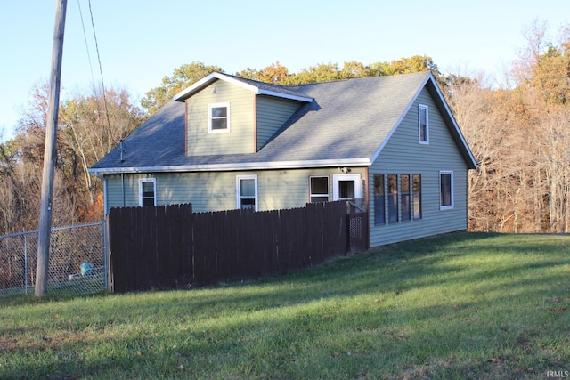 view of home's exterior featuring a lawn