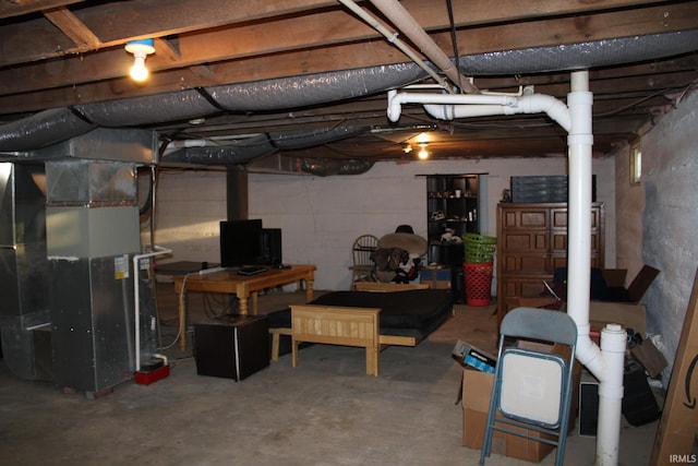 basement featuring heating unit