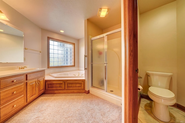 full bathroom with shower with separate bathtub, a textured ceiling, toilet, tile patterned floors, and vanity