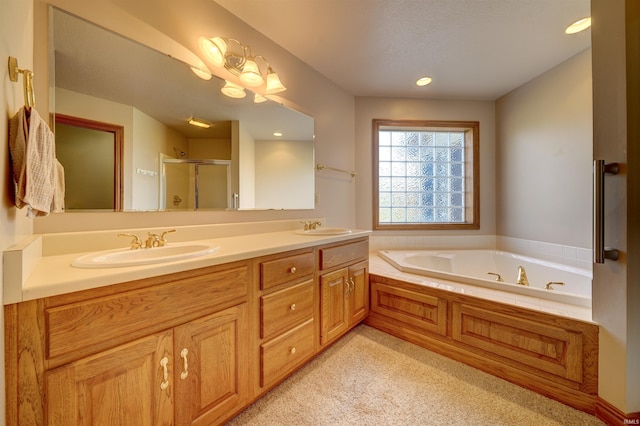 bathroom featuring vanity and separate shower and tub