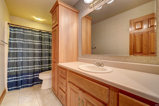 bathroom with a textured ceiling, toilet, vanity, a shower with curtain, and tile patterned flooring