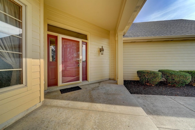 entrance to property featuring a patio area