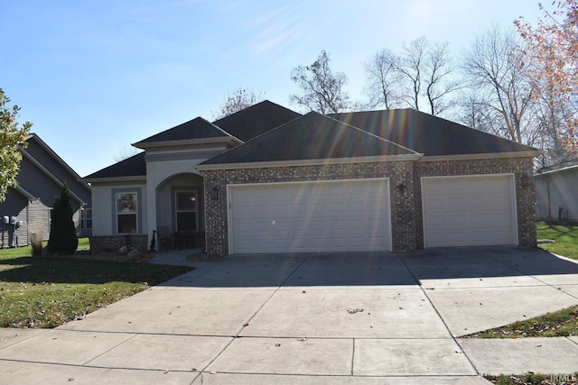 view of front of house with a garage and a front yard