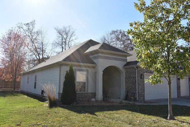 view of front of house with a garage and a front yard