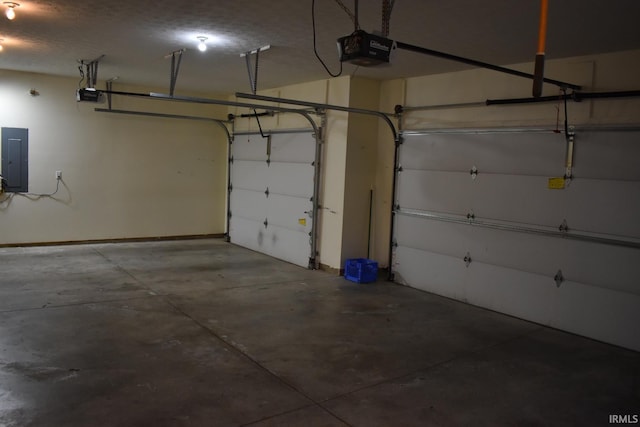 garage with electric panel and a garage door opener