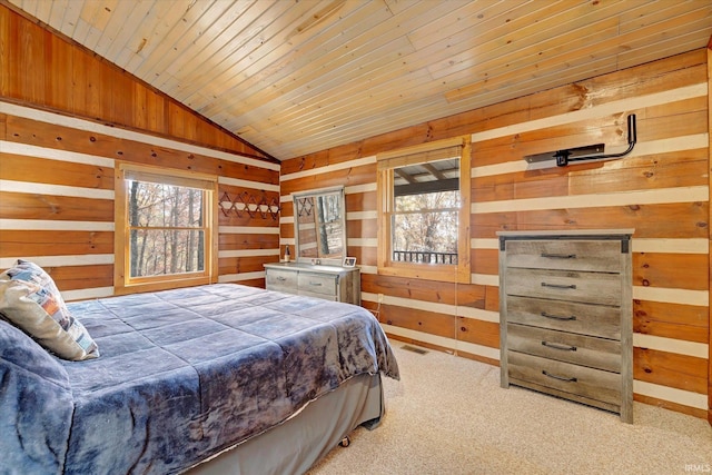 carpeted bedroom featuring lofted ceiling, wooden ceiling, and wood walls