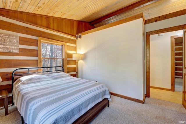 bedroom featuring wood ceiling, wood walls, lofted ceiling, and light carpet