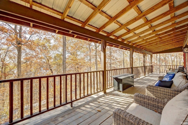 sunroom / solarium featuring lofted ceiling