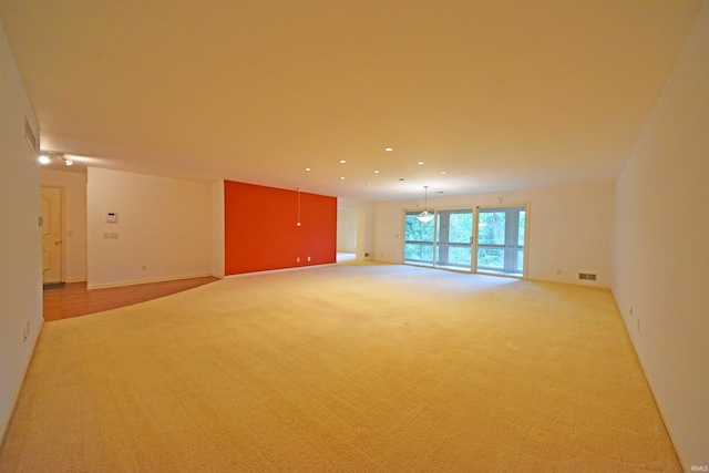 empty room with light colored carpet