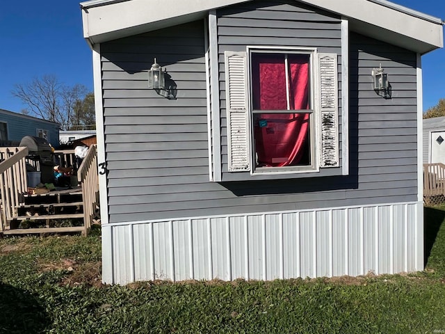 view of home's exterior featuring a deck