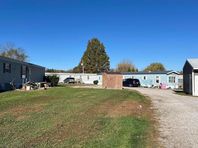 view of yard with a storage shed