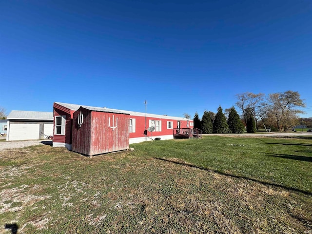 exterior space with an outbuilding and a garage