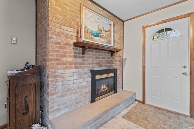 interior space featuring ornamental molding and a fireplace