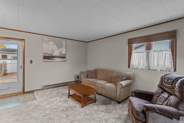 living room featuring ornamental molding, a wealth of natural light, and a baseboard heating unit