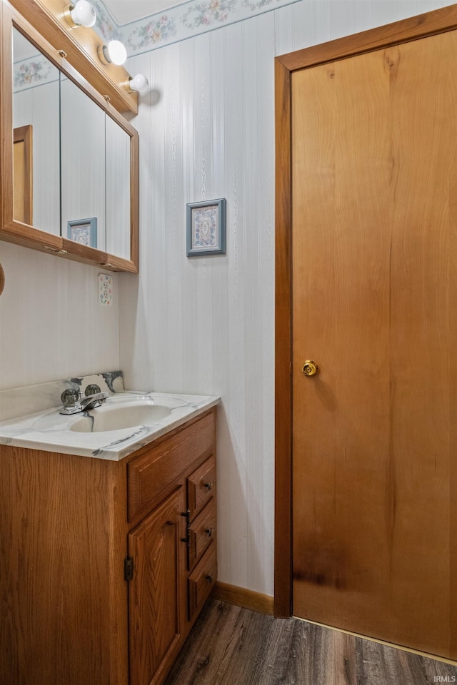 bathroom featuring hardwood / wood-style flooring and vanity