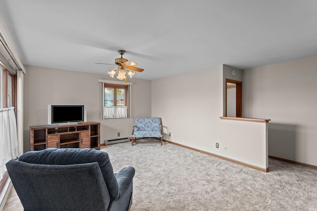 carpeted living room featuring ceiling fan and baseboard heating